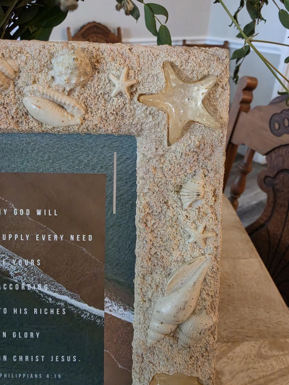 Textured beach picture frame decorated with real seashells and faux-sand finish